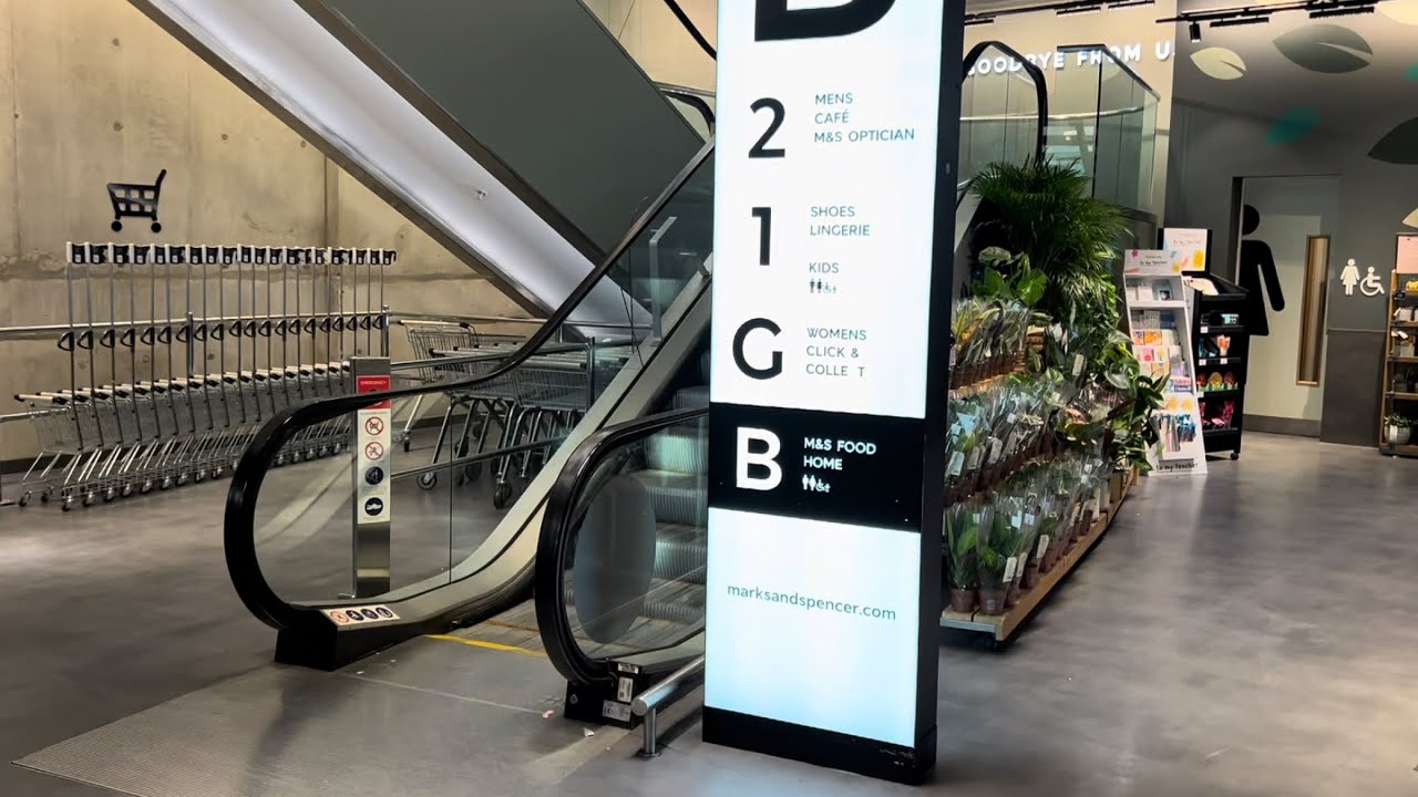 Manchester, England. 4x O&K KONE escalator ride at Marks and Spencer Department store - Arndale