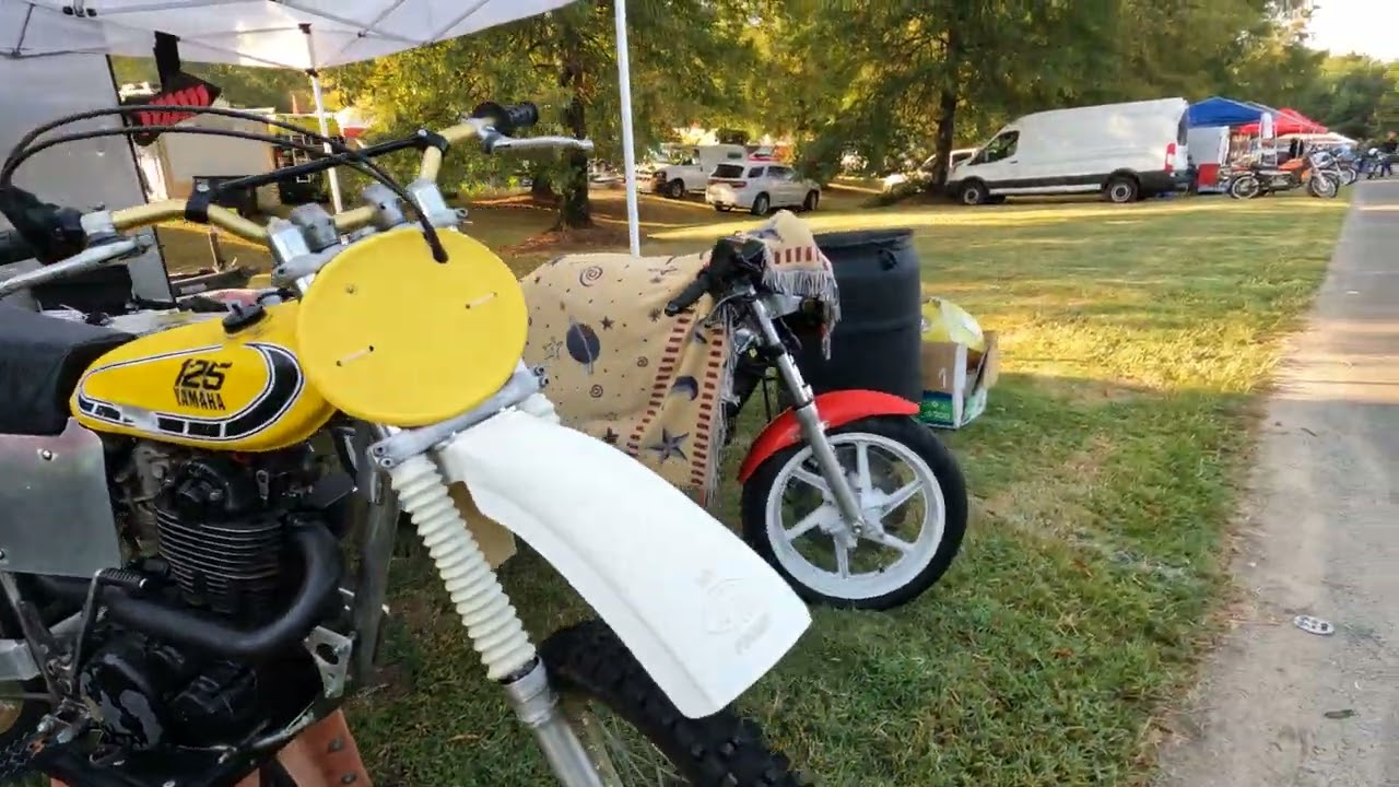 Motorcycles, parts, and memorabilia for sale at the 2022 Barber Vintage Lower Swap Meet 2nd Row