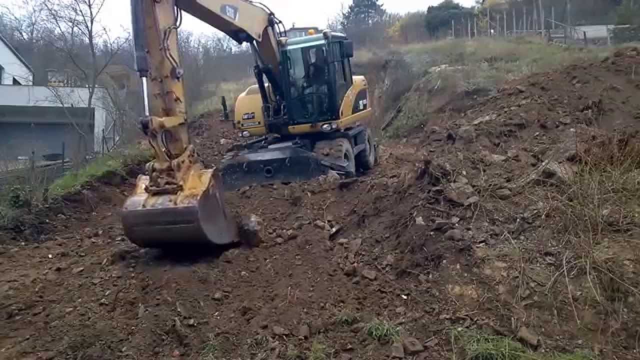 Caterpillar M313D in action