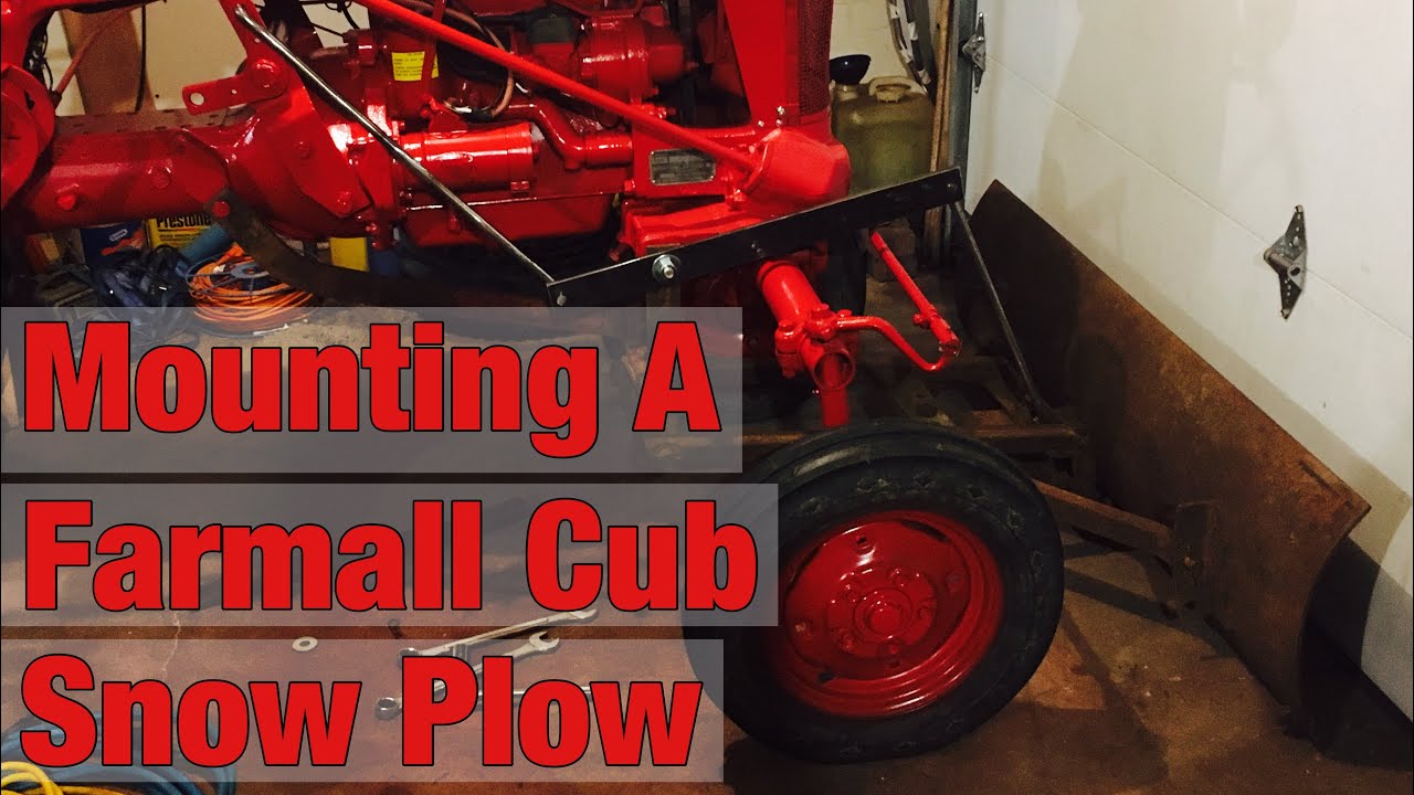 Mounting the snow plow on the cub
