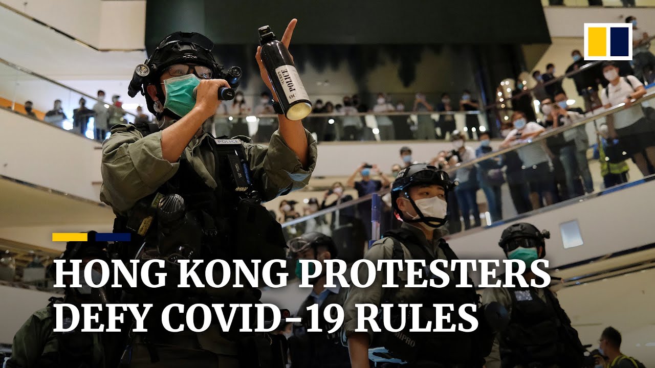 Hong Kong protests: police disperse demonstrators for defying coronavirus rules on crowd sizes
