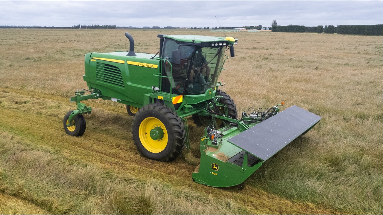John Deere W260 Windrowing Grass Seed
