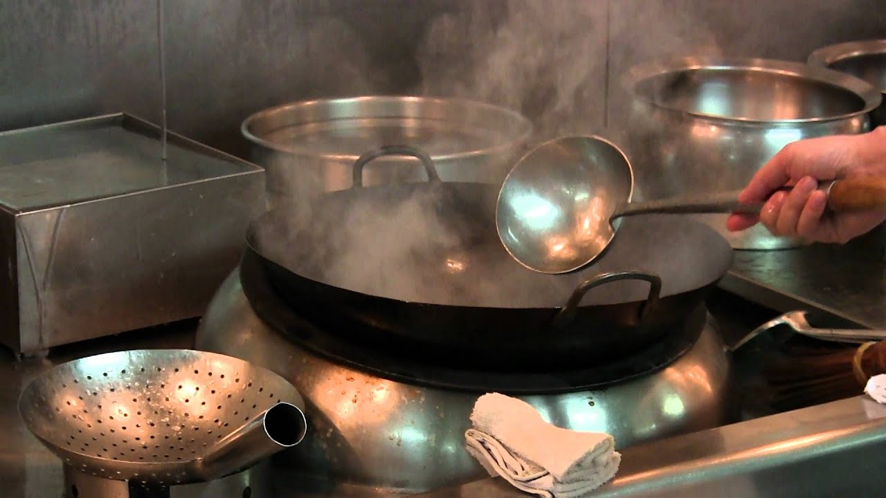 Mok Kit Keung prepares a dish at Shang Palace, HK