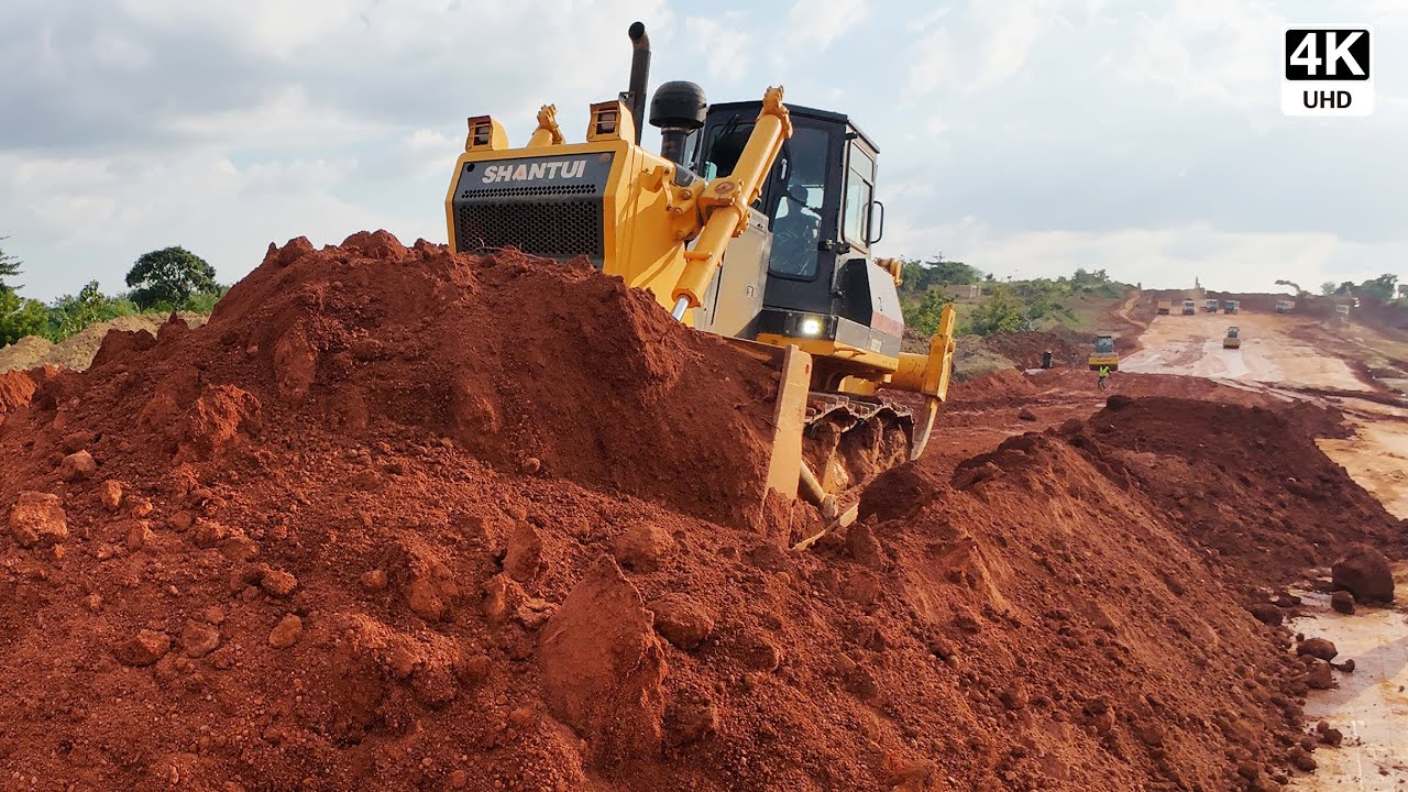 Massive Bulldozer Levels Sand from Dump Trucks on the Sunyani Outer Ring Road Construction 4K