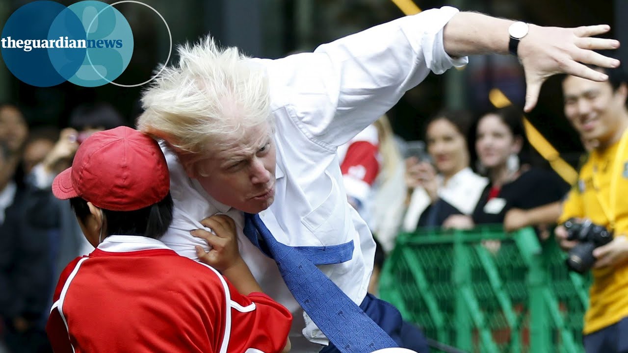 Boris Johnson knocks over boy in rugby match in Japan