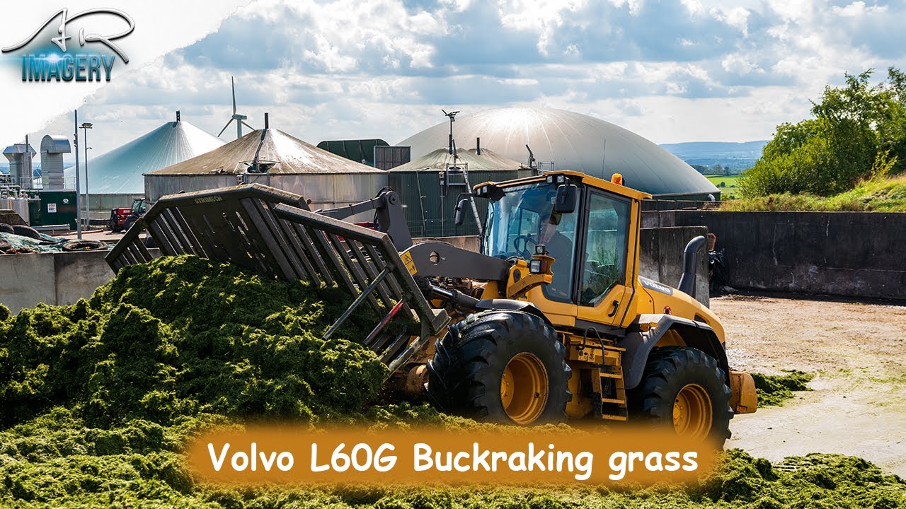 Volvo L60G buck raking grass for the digester