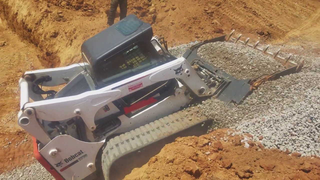 A Bobcat T770 In The City Spreading Stone