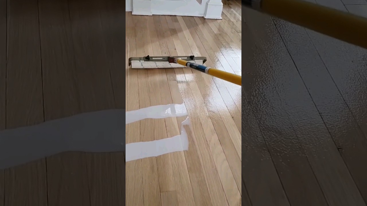 hardwood floor refinishing applying water-based poly #floorrefinishing #woodflooring #woodworking