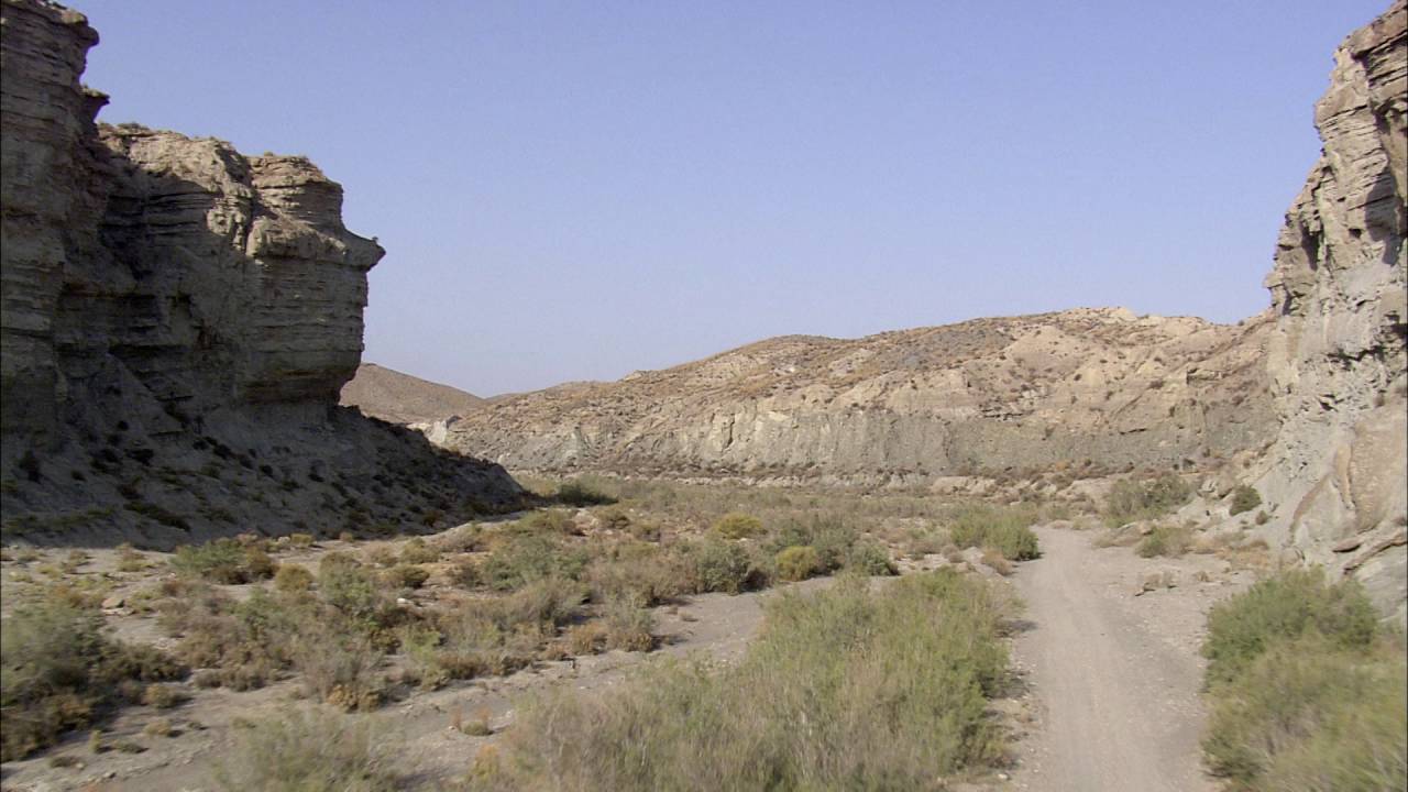 Low Over Deserts & Arid Landscape: 1 min aerial stock footage montage (024)