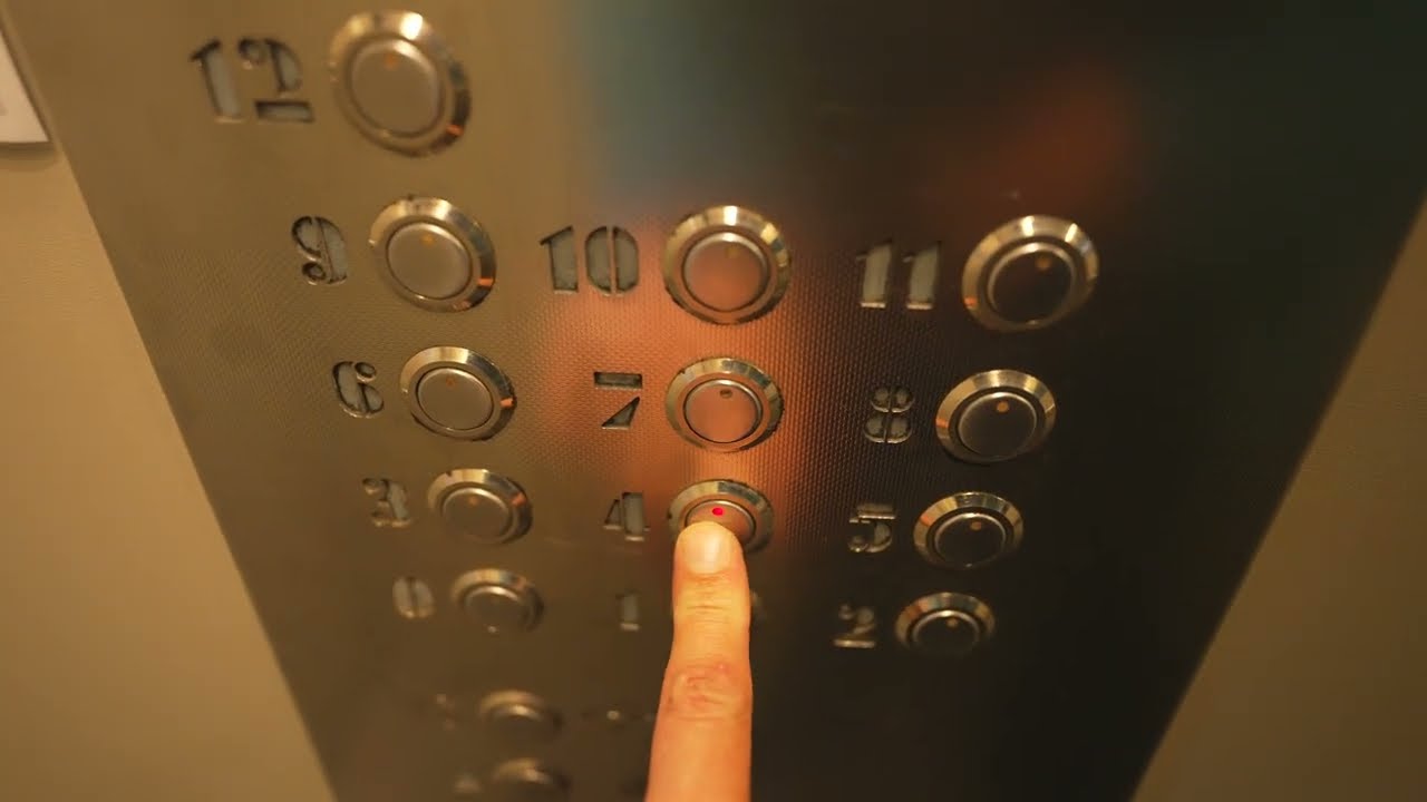 Poland, Warsaw, WINDA - WARSZAWA Sp. z o.o elevator - going up @ night