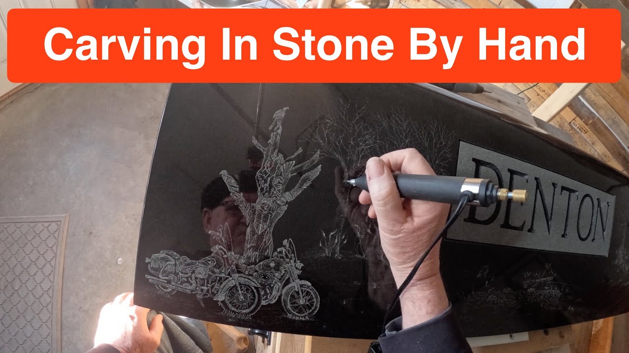 Hand engraving a headstone