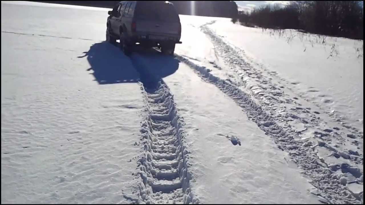 Mazda B2500 with chains snow offroad in Rissia