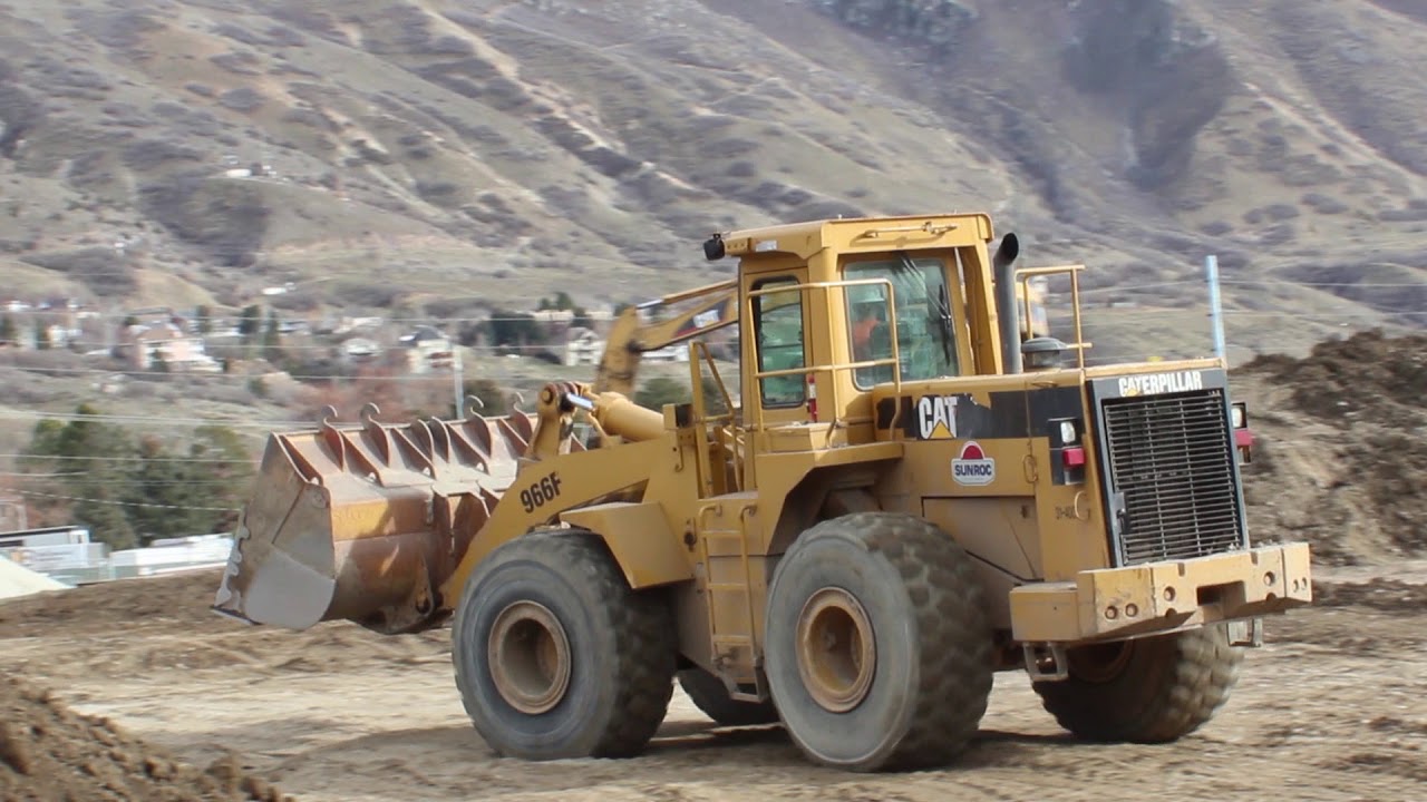 Double Big Rig SideTipping Dump truck unlaoding with a CAT 966F Loader and 320C excavator working on