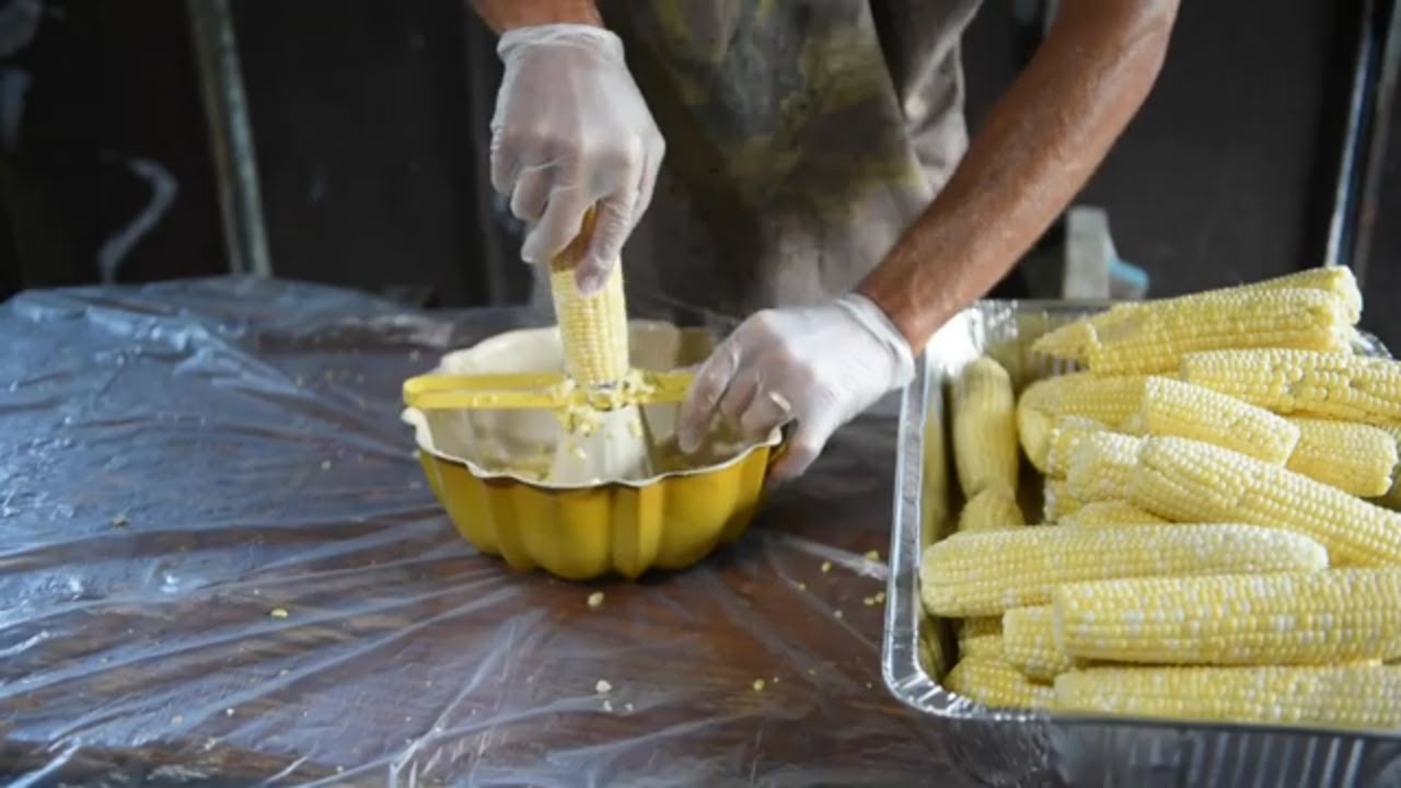 Easiest way to cut corn off the cob for freezing or canning. Using bundt pan and kernel cutter