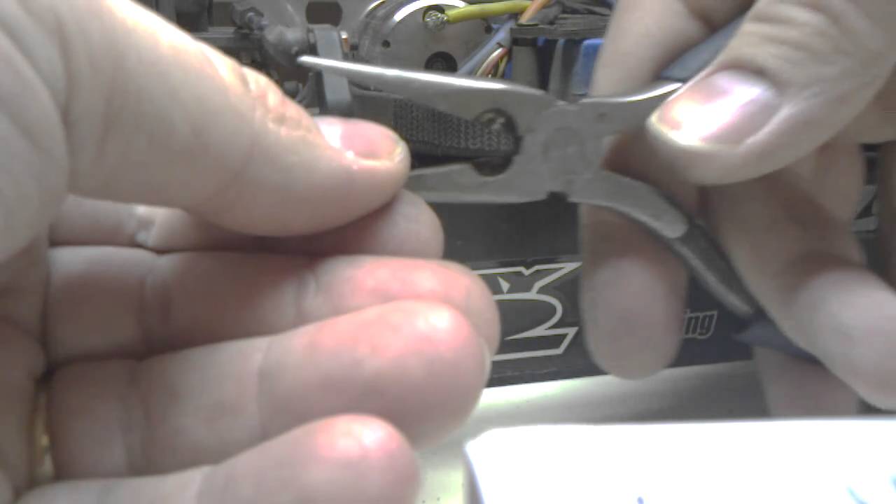Man hands roll pin installation.
