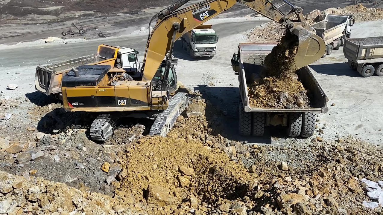 Caterpillar 390D Excavator Loading Fleet Of Mercedes & MAN Trucks And Dumpers - Pyramis Ate