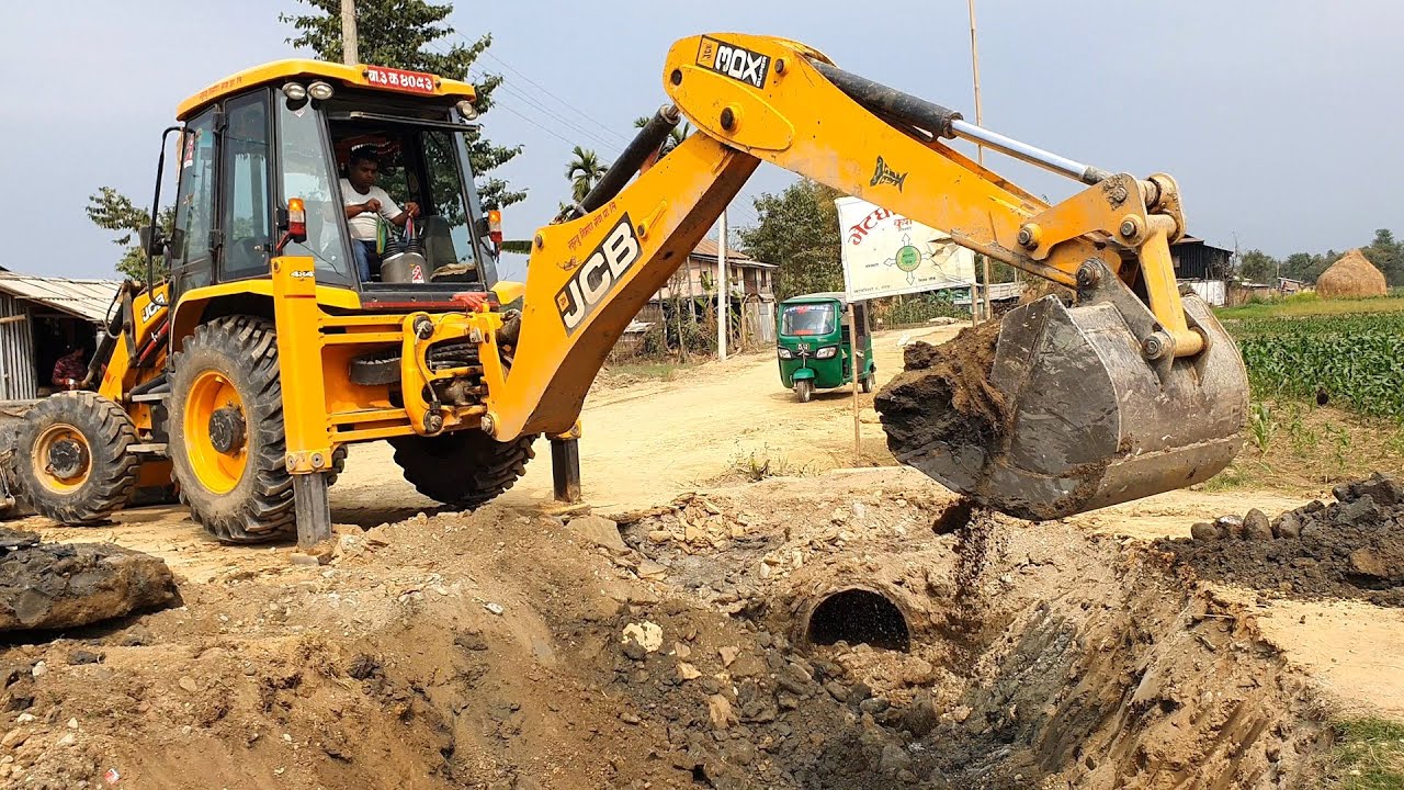 JCB Backhoe Digging and Making Drain in The Middle Of Road To Install New Culvert Pipe - JCB Video
