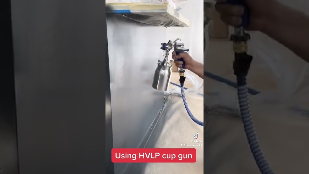 Spraying Cup gun H.V.L.P. Using Fine Paints of Europe water base