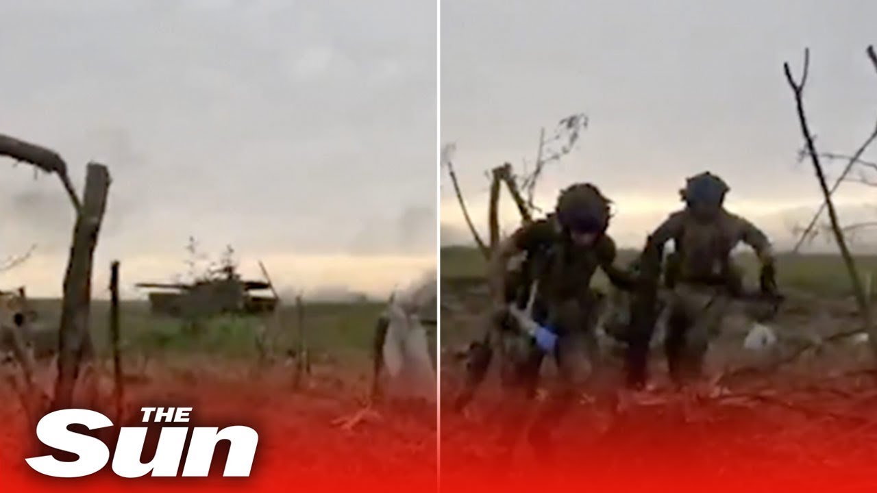 Ukrainian soldiers take cover from Russian tanks near Melitopol