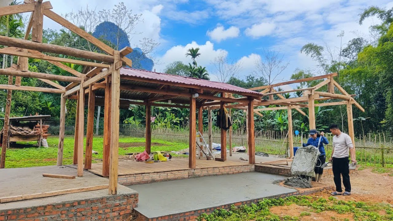 CUONG & LAN excitedly built an additional small yard and flowerbeds for their new house.