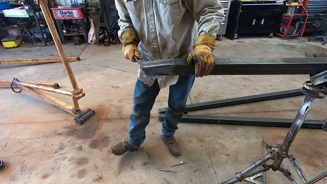 Welding broken skid steer boom attachment.