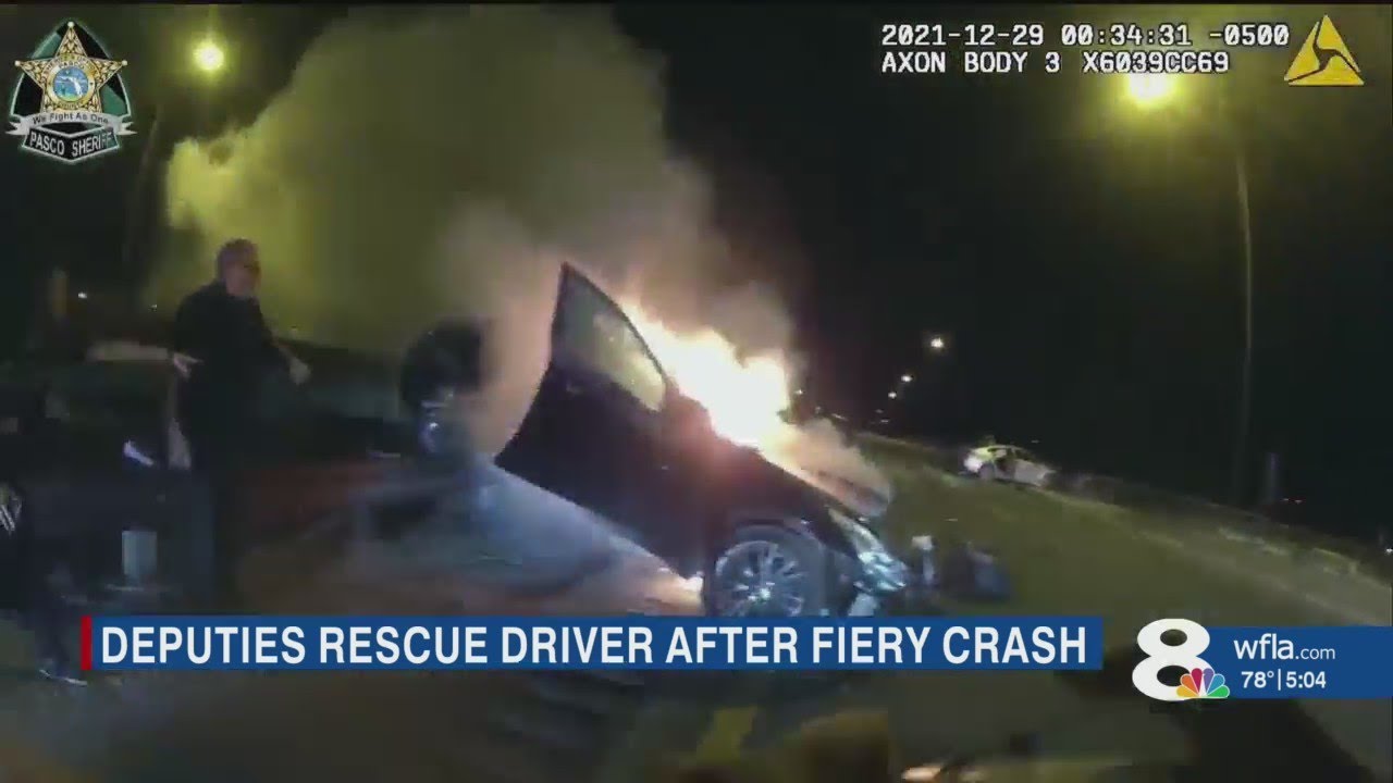 Pasco Deputies rescue woman from burning car 'seconds' before it was engulfed
