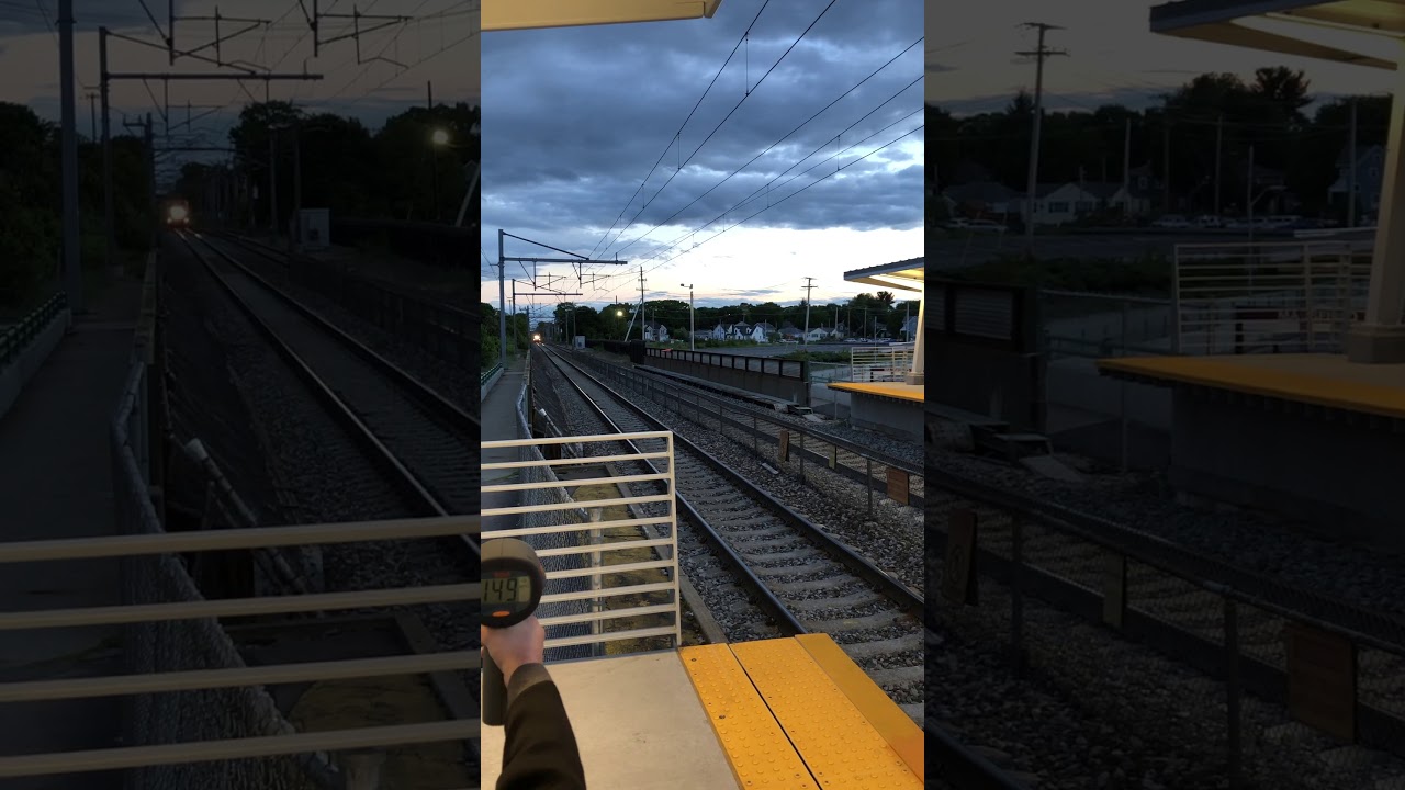 Acela train passing Mansfield 150 mph at evening time.