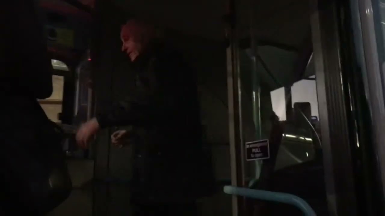Passengers arguing with a First Essex bus driver for being late