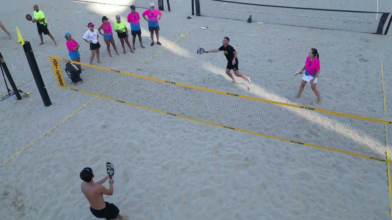 Sandy Pickle is a modified version of pickleball played on grass and sand.