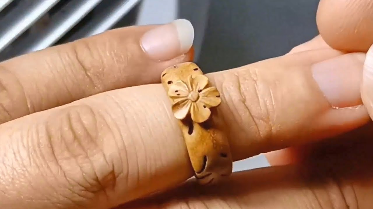 Unbelievable! This exquisite ring is actually carved from peach pit | wood carving