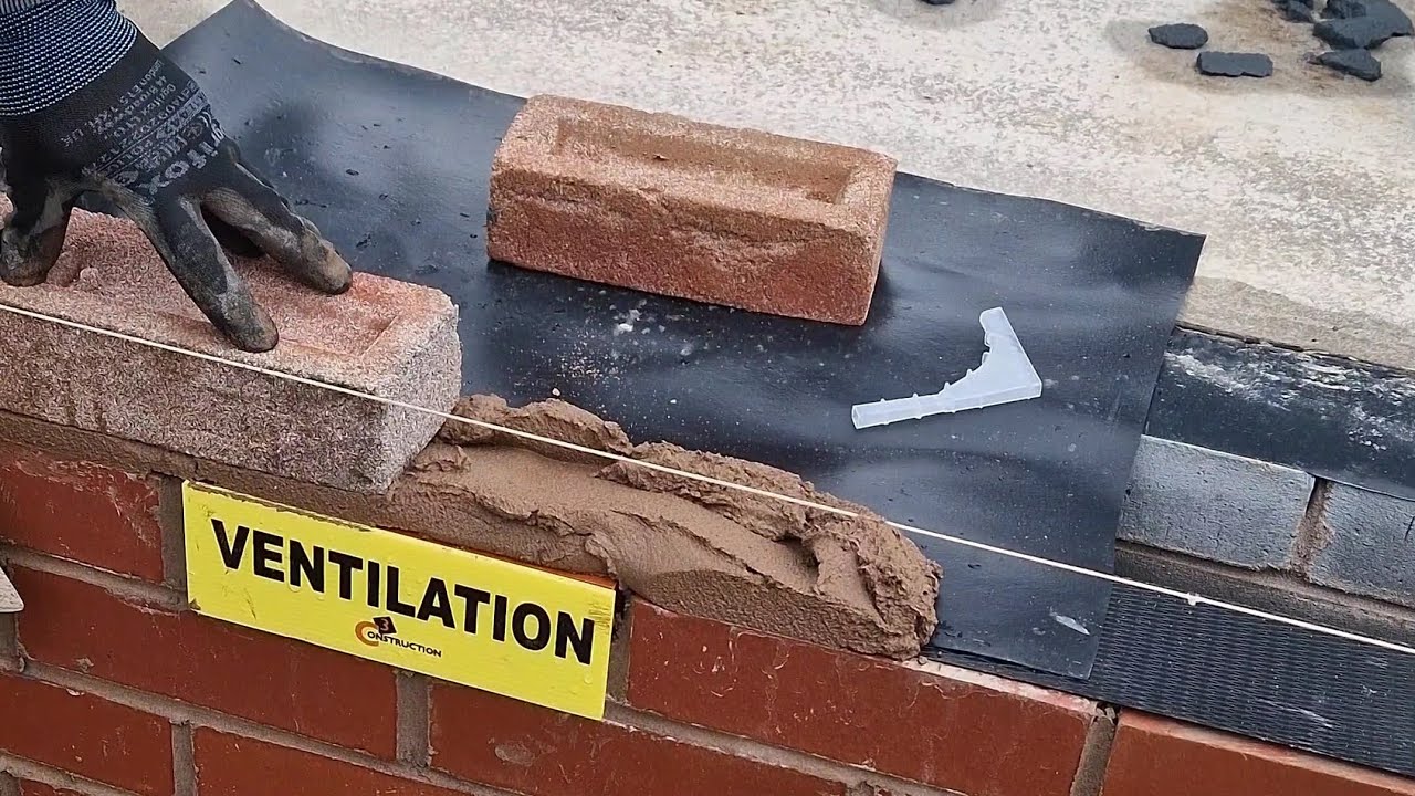 Installation of DPC tray to ventilation brick.