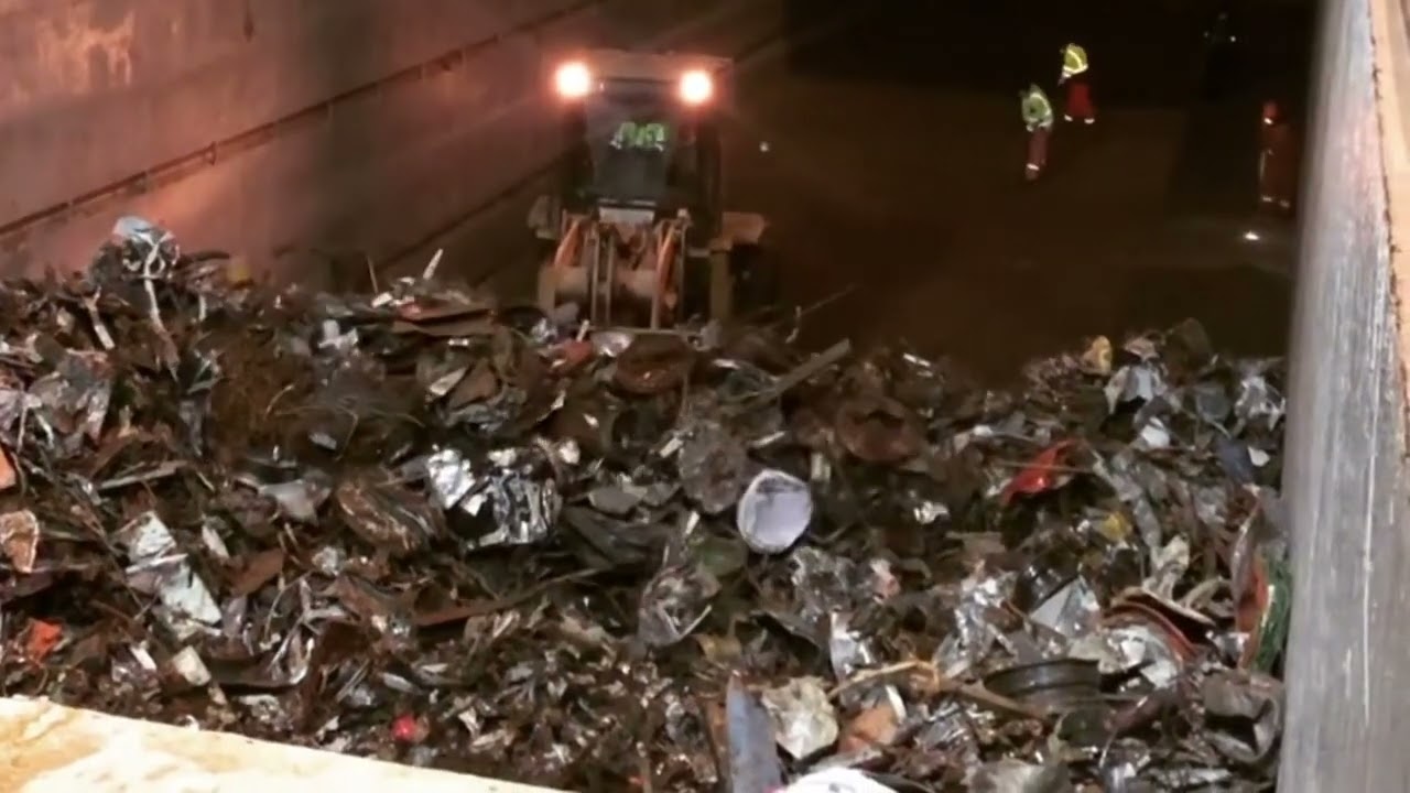 Export of scrap metal from Russia. Unloading of a cargo ship at the seaport. IEC.