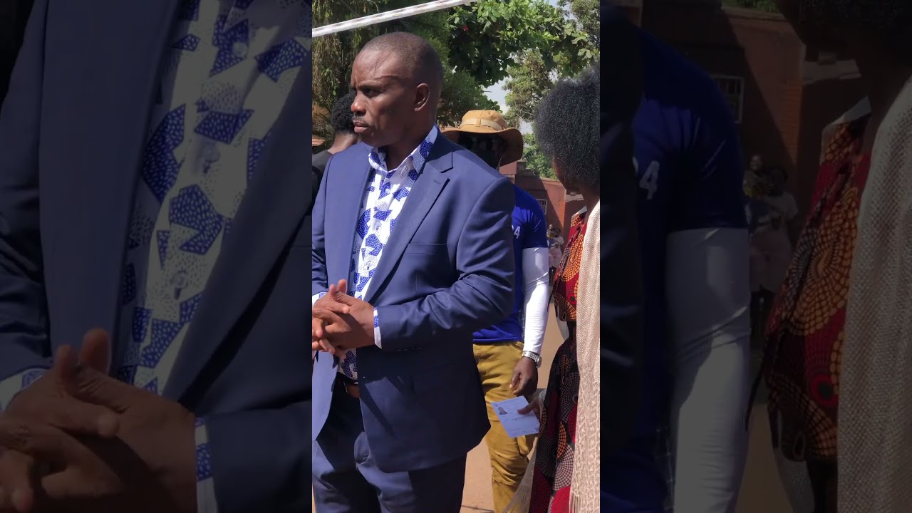 Lord Mayor Erias Lukwago,wife and daughter arrive at the polling station.