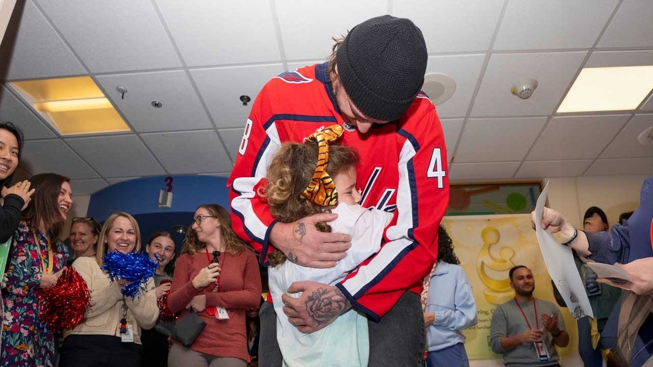 Logan Thompson surprises Sutton, a 7-year-old cancer patient, at bell-ringing ceremony