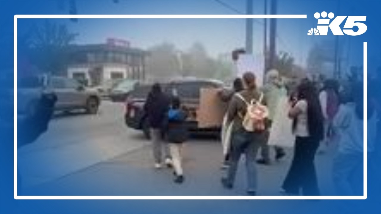 Protesters block ICE vehicle from entering Tacoma strip mall