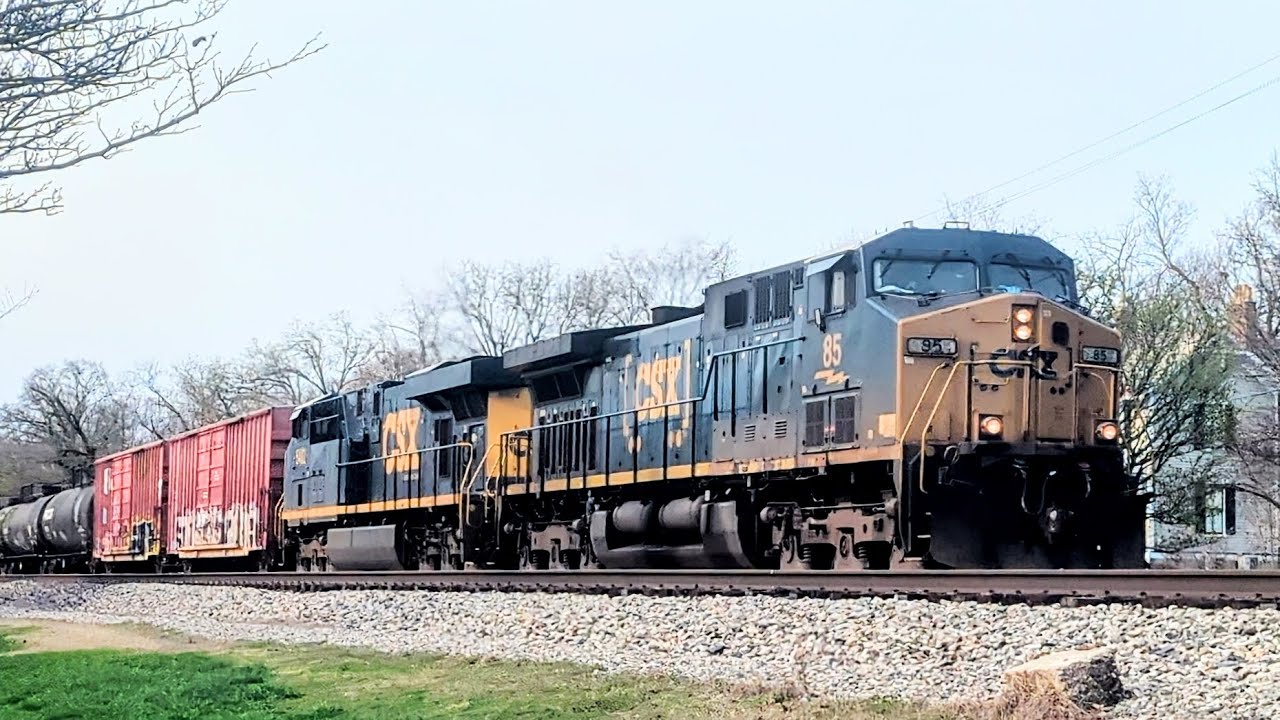 Northbound CSX mixed manifest on track one with a friendly crew blowing several times 