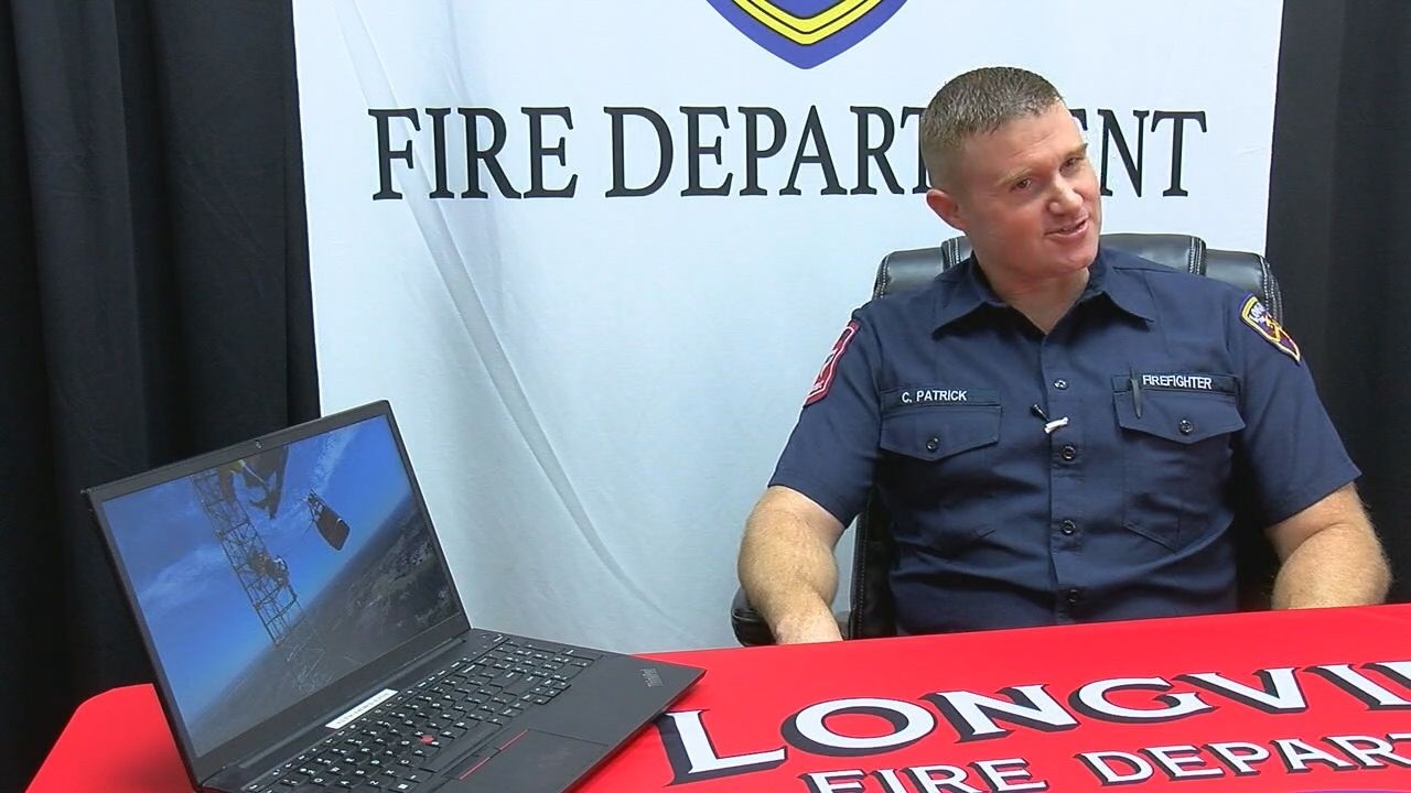 Longview firefighters describe rescuing 2 from hot air balloon caught in tower over 900 feet up