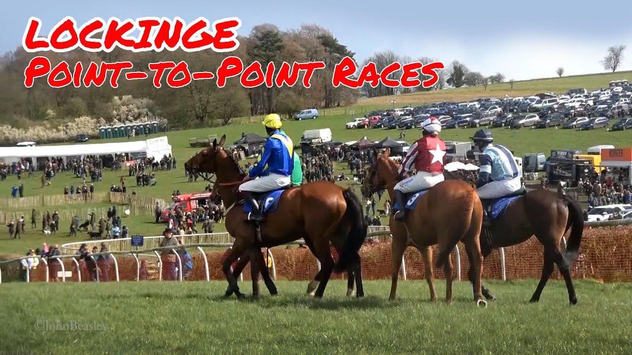 Point-to-point horseracing action at Lockinge, Oxfordshire, huge crowd view amateur steeplechasing.