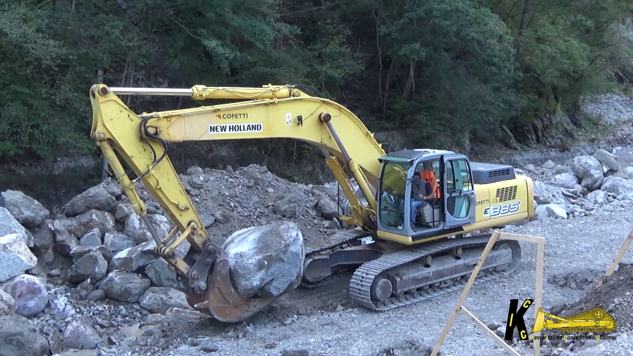 New Holland E385 Excavator Posing Rocks in the River