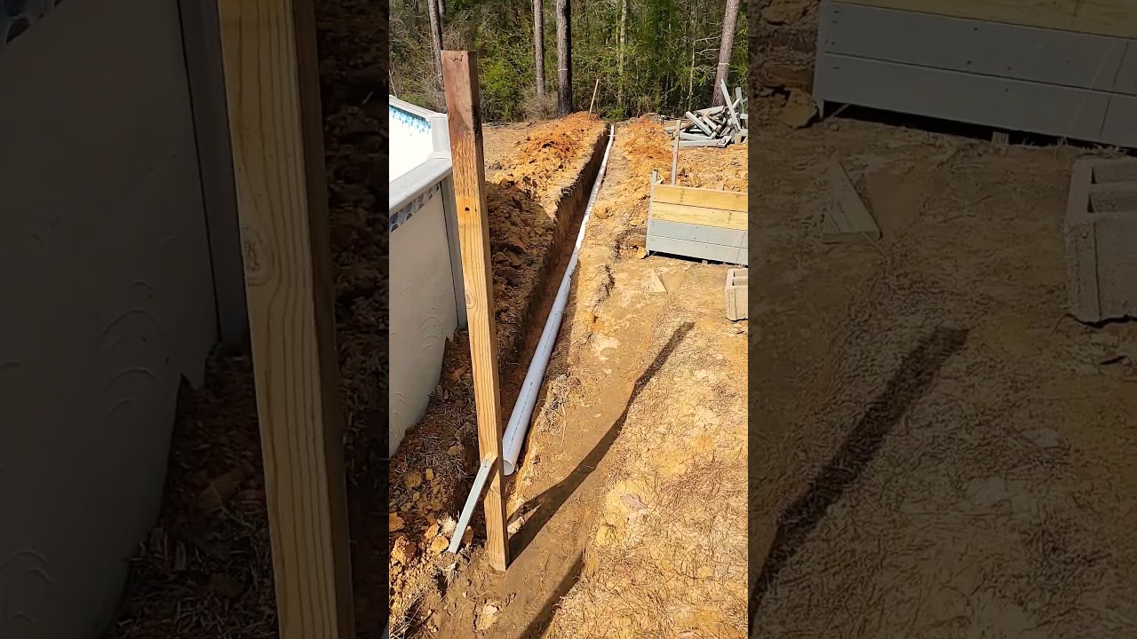 DIY outdoor kitchen running water line into foundation