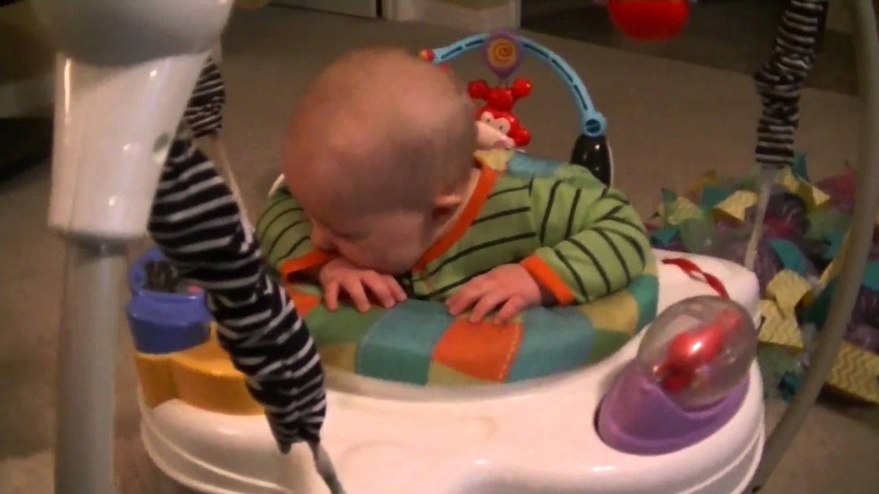 Baby laughing while getting tickled by puppy