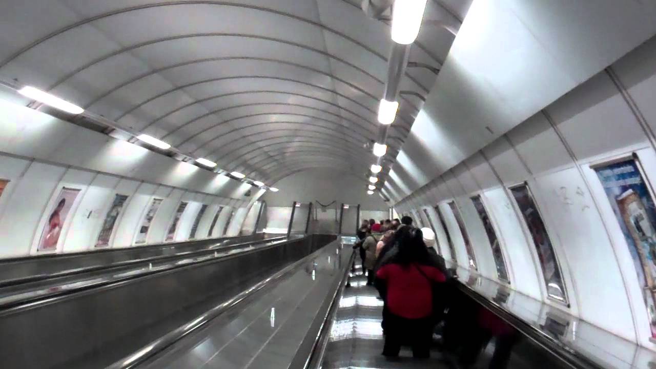 Descending 87m deep escalator at Namesti Miru, Prague, Czech Republic