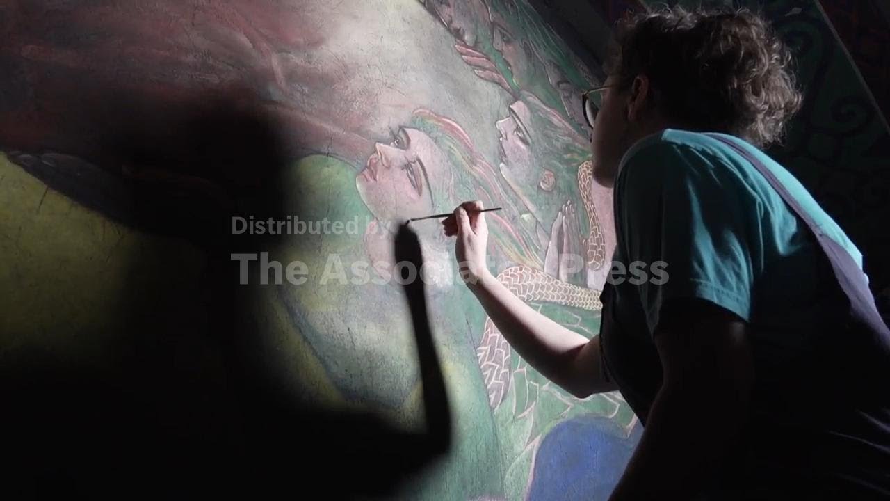 A conservation team preserves historic church murals of faith and social justice