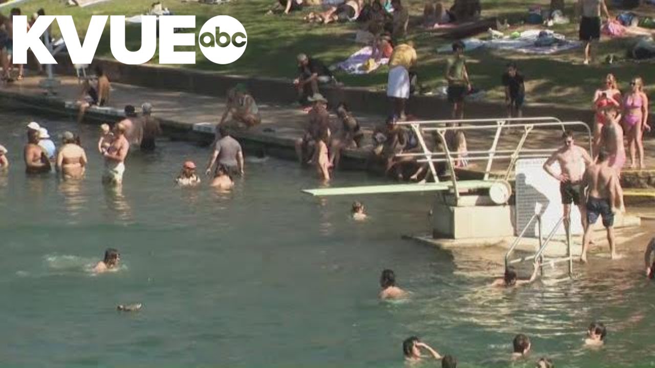 Barton Springs Pool reopens after construction delay, draws large crowds amid record heat