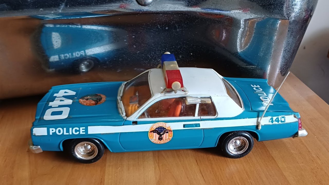 Police car toys from the 1980s battery operated vintage retro Camaro Dodge Monaco 