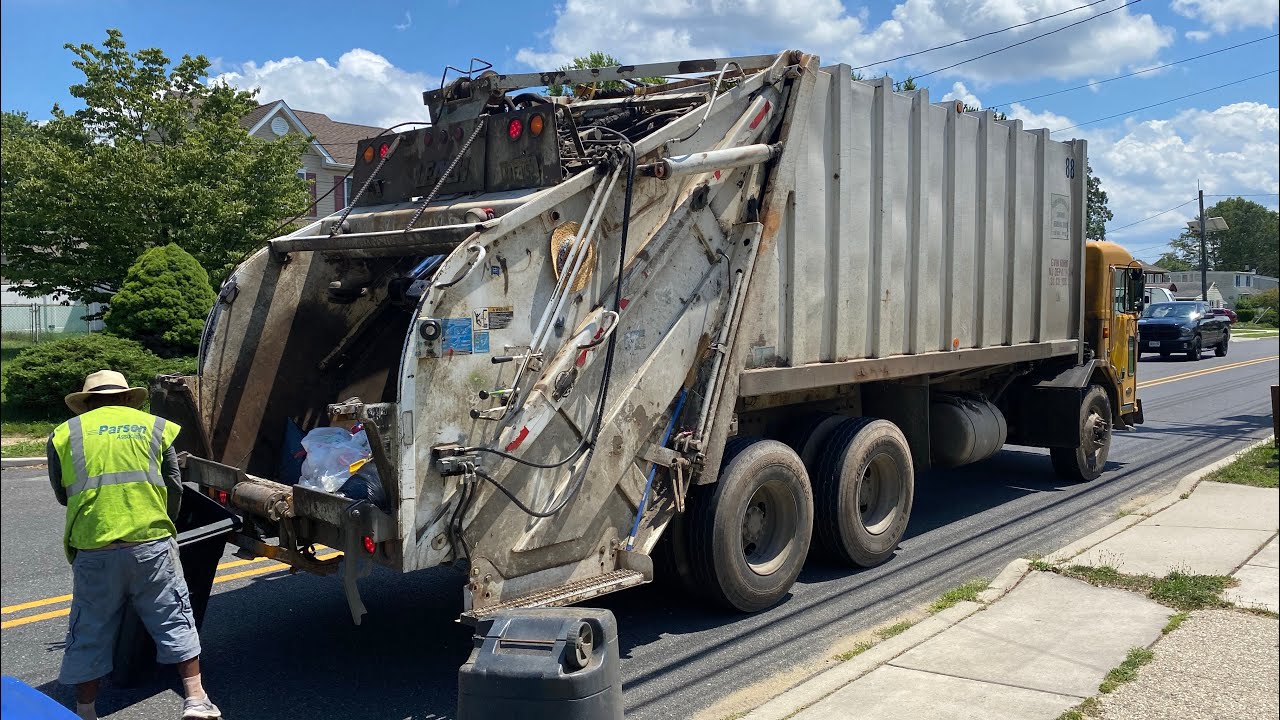 Two Peterbilt 320 Leach 2Rll Garbage Trucks on Wednesday Routes