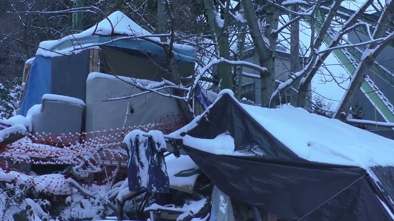 Seattle's homeless encampments during freezing winter snowstorm.