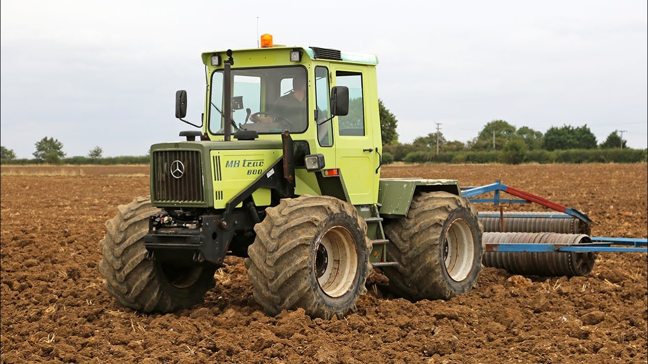 Rolling ploughed land with classic German Mercedes-Benz MB-Trac 800 and 9m Hunt Manifold rolls