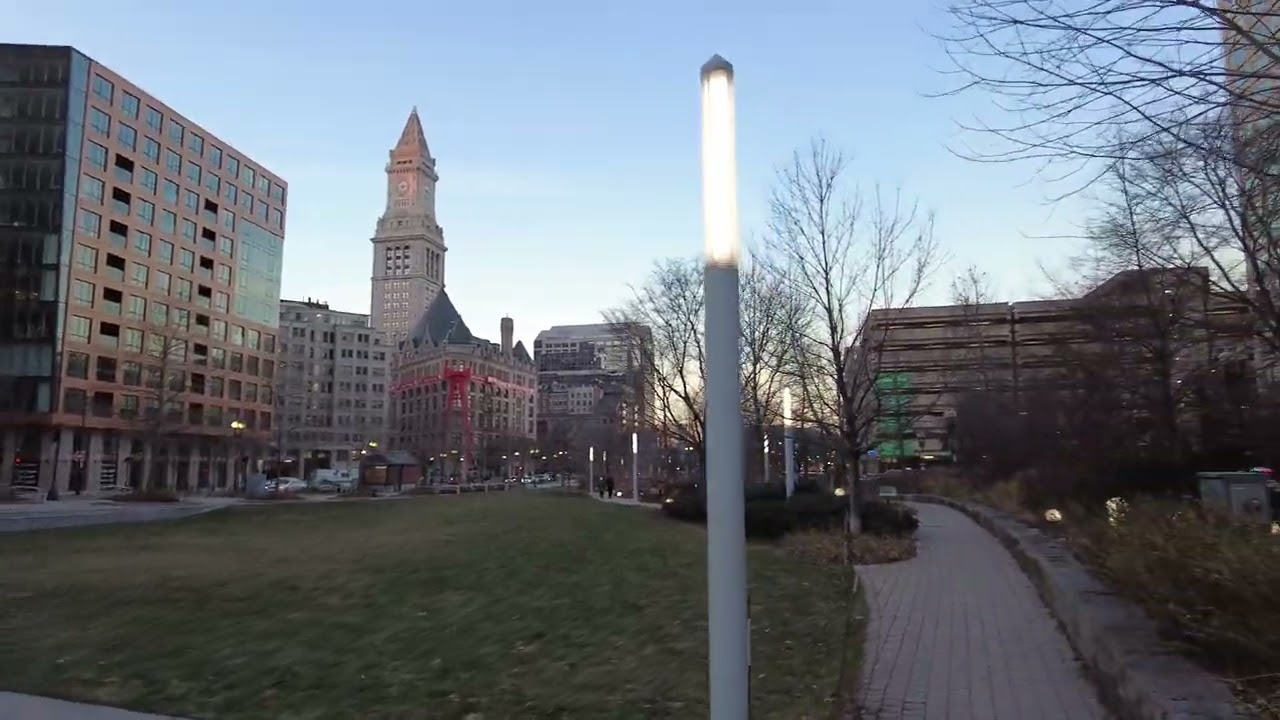 Boston MA Walk on the Rose Kennedy Greenway Atlantic Ave and Purchase St at Sunset. South Station.