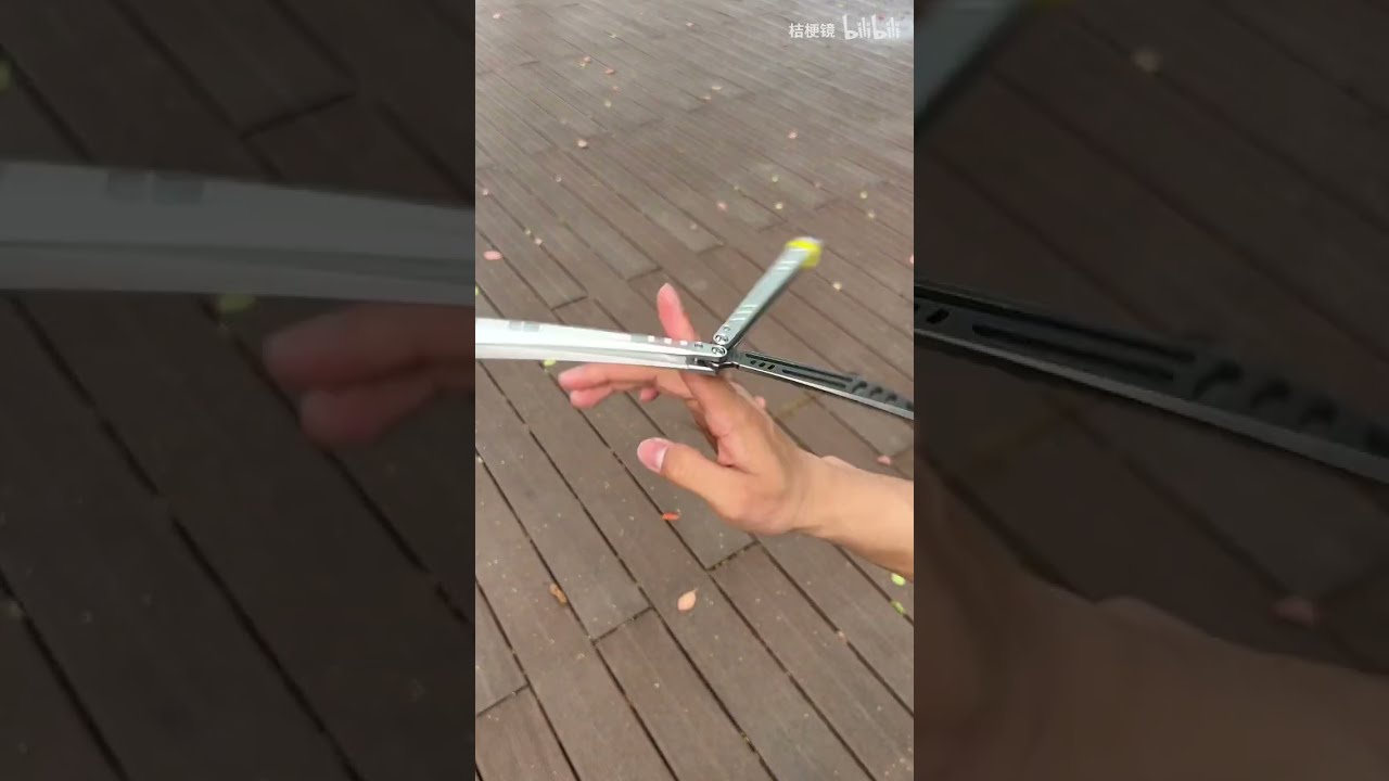 World champion knife thrower plays with butterfly knives